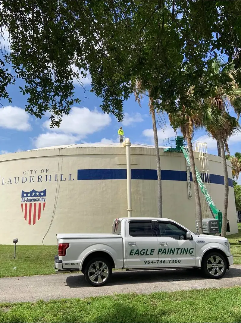 City of Lauderhill building with an Eagle Painting truck during a repaint