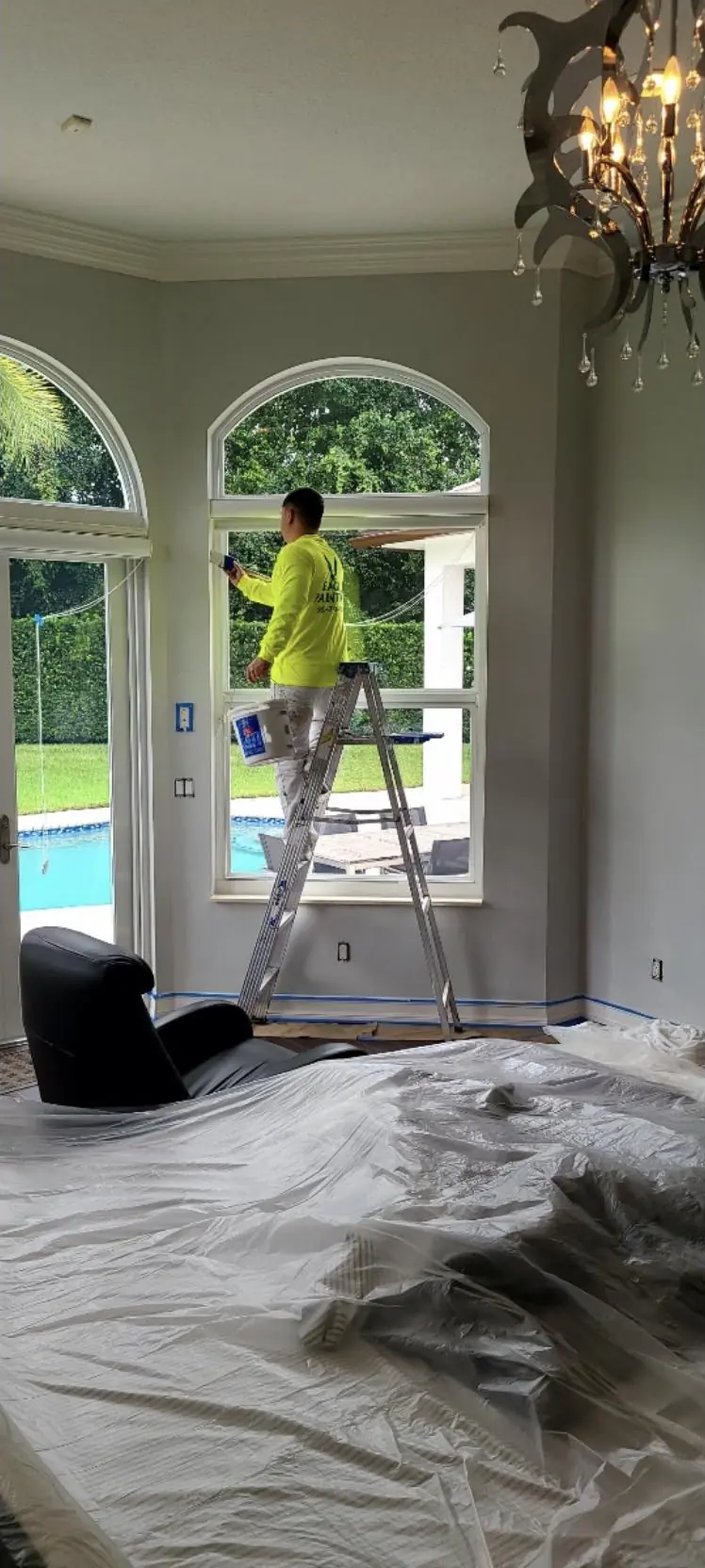 Cutting in around arched windows in a Florida living room