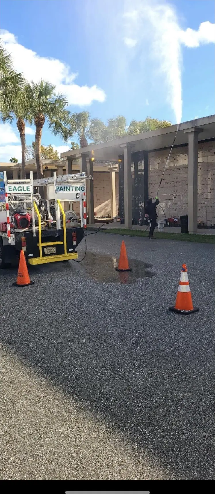 Eagle Painting crew pressure cleaning a commercial parking lot