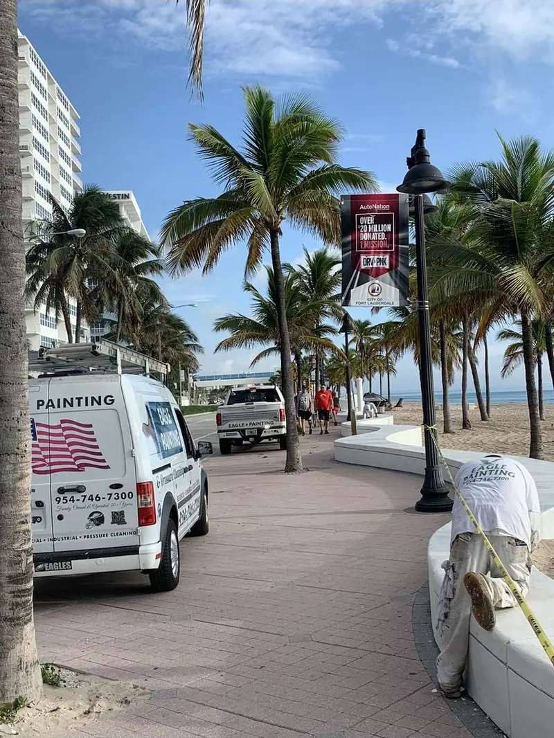 Eagle Painting van parked on A1A at Fort Lauderdale Beach during a job